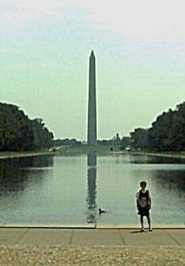 Joe in front of the reflecting pool viewing the Washington Monument